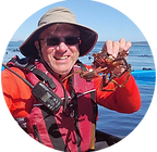 Holding a Kelp Crab During Kayaking Trip in the San Juan Islands